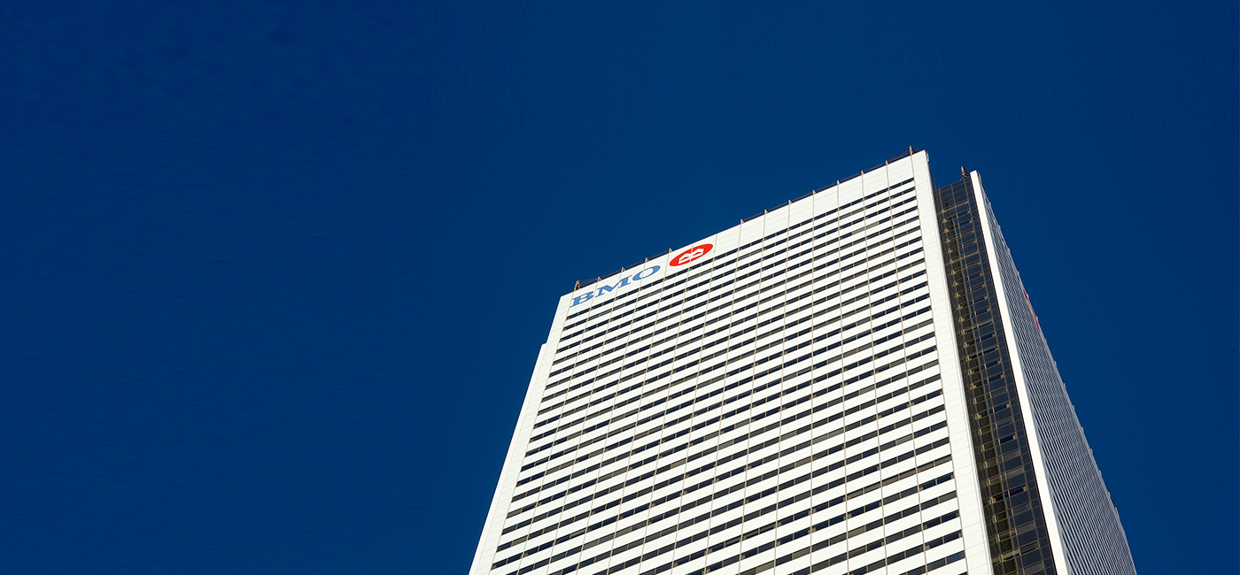 Image of the top of First Canadian Place with clear blue skies
